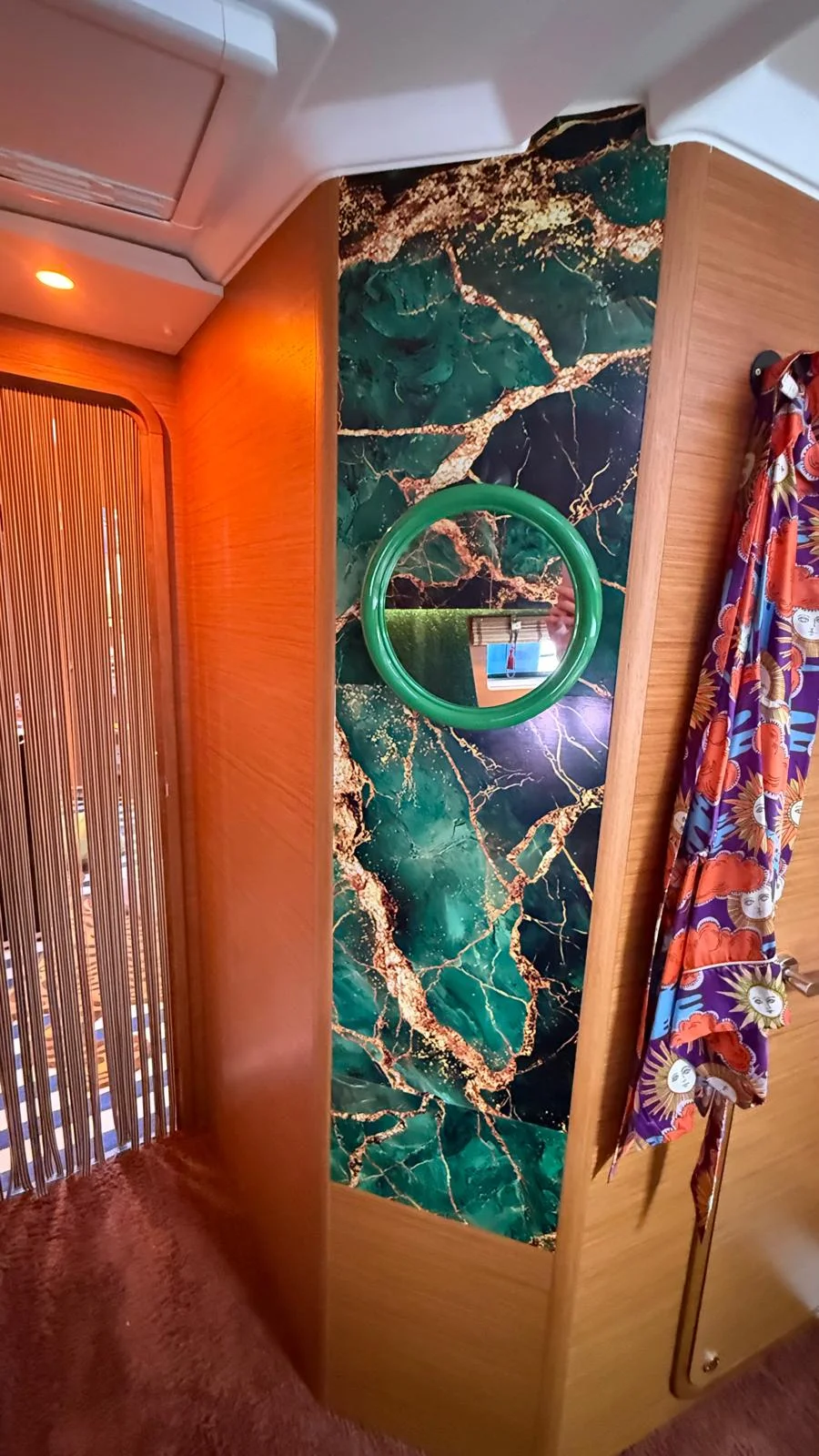 Green wall and bathrobe interior aboard the Capitana